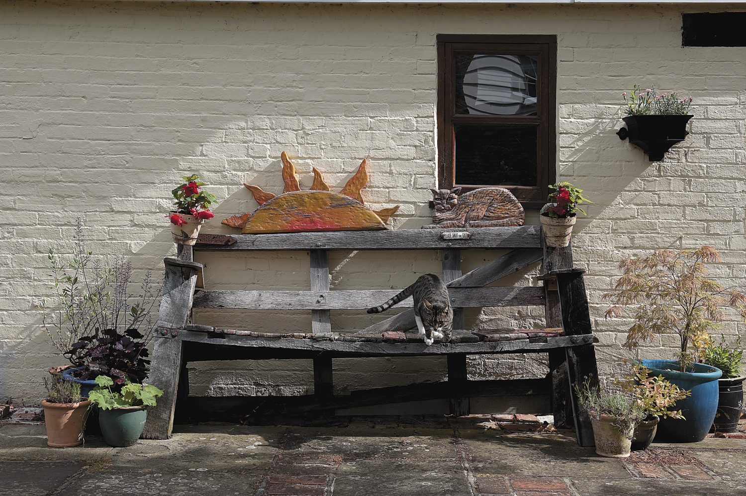 Lucy Williams’ stunning bench hints at the artistic treasures inside the house. This is a real talking point for visitors and a blissful seat for a cat, when there is no one else about!