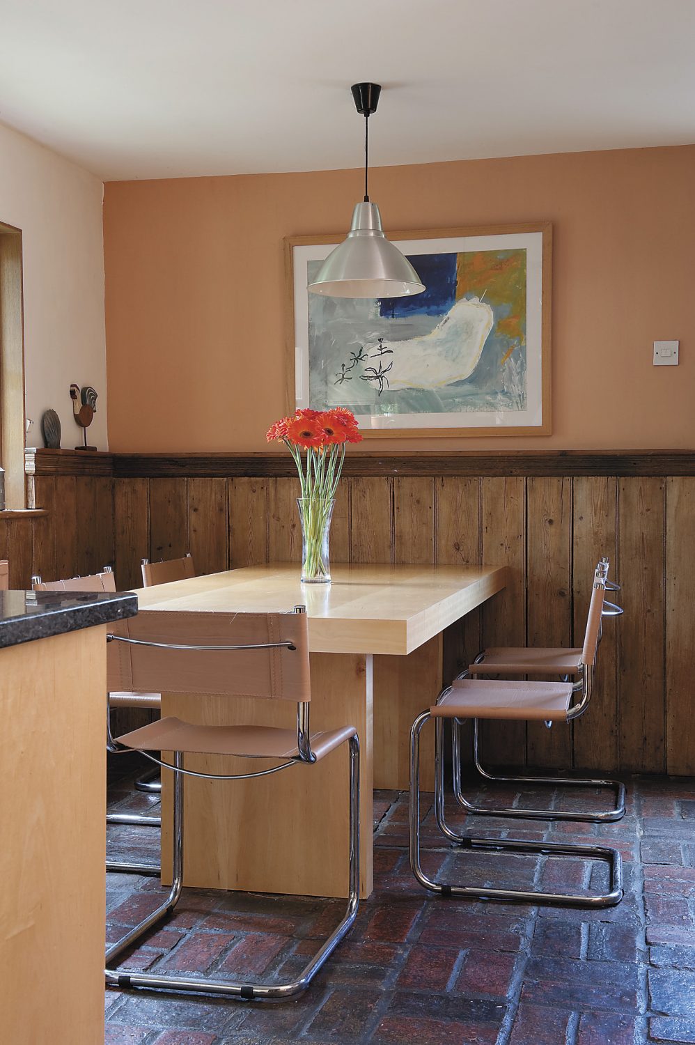 art is a key feature in the home – this piece above the dining table was painted by a college colleague of Barry’s