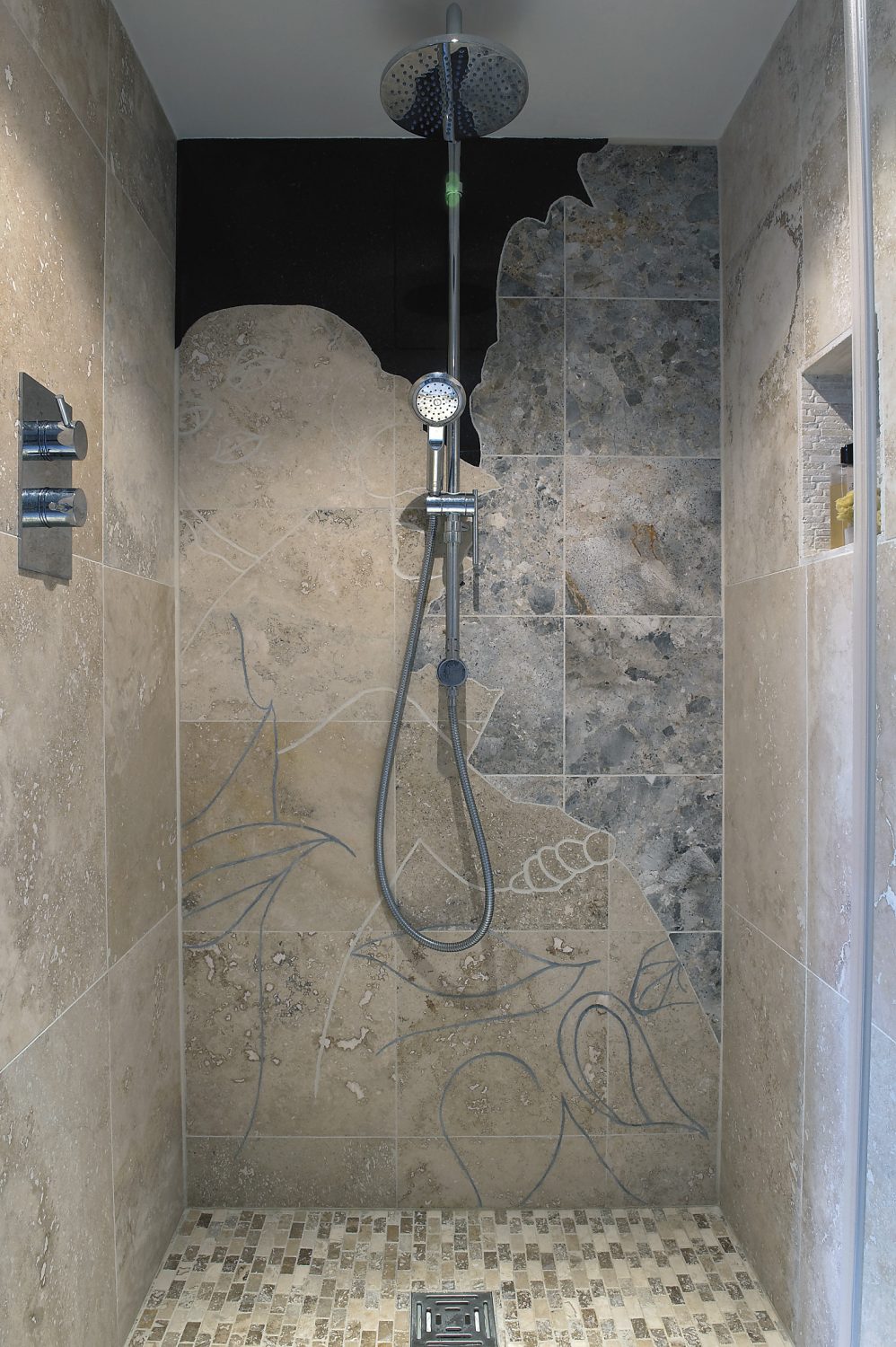 Sally hand cut the stone in her walk-in shower to create a design by her brother, the artist Gary Hume