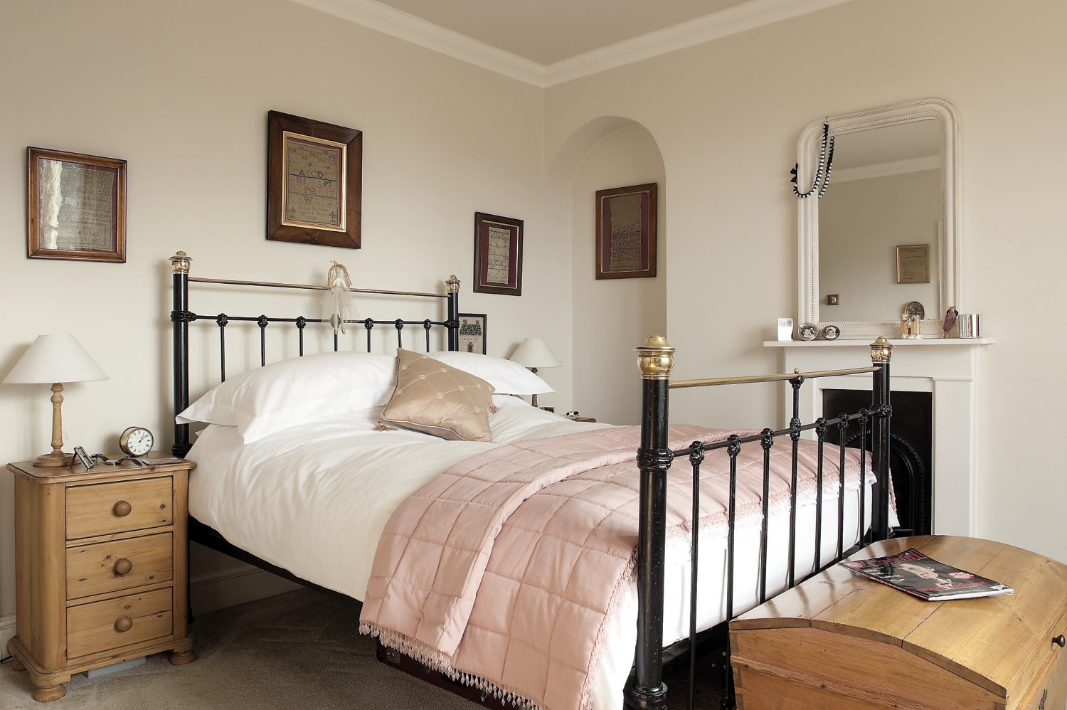 An iron bedstead holds centre stage in the master bedroom. Either side of the chimney breast and above the bed there are framed antique samplers. “When I first started work, it was in an auction house and one of the guys there used to collect old samplers. I bought one and just caught the bug,” says Brad