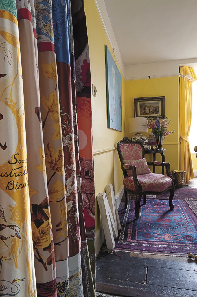 the fauteuil-style chairs are covered in Designer’s Guild devoré velvet. Maggie made the window curtain out of her large collection of silk scarves