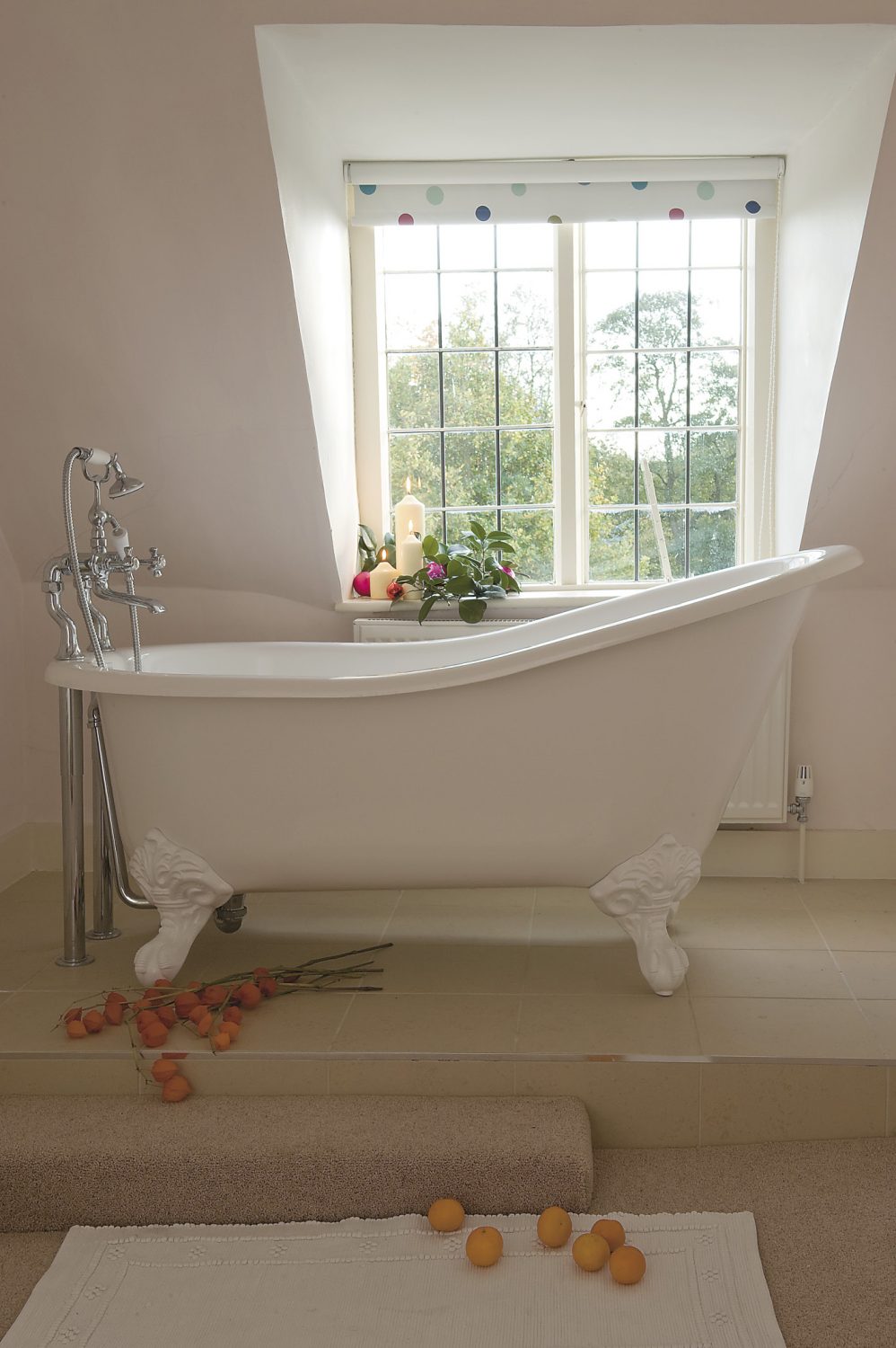 a glorious, free-standing bath sits near a window giving a beautiful view of the garden. Jemima says: “this is the best position for a bath ever – such a wonderful view”...