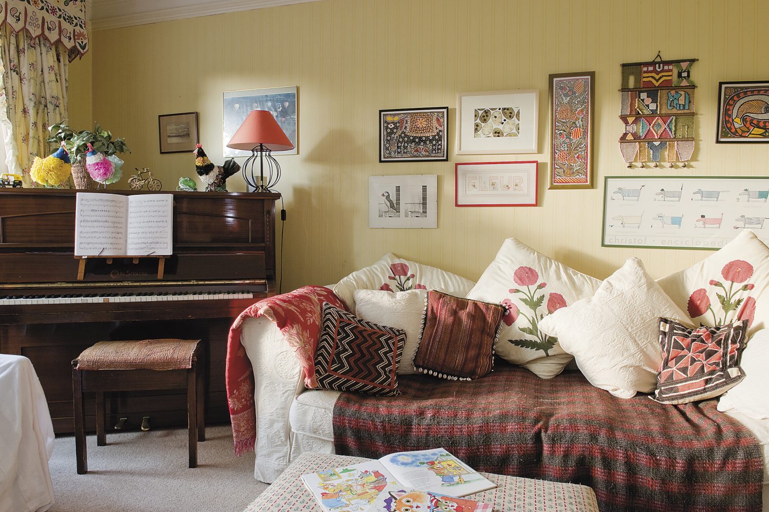 cushions, throws and artworks gathered on trips overseas add a splash of Eastern colour to a traditional Wealden hall house
