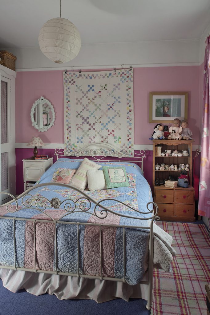 Daughter Harriet’s bedroom holds a double bed covered with vintage and homemade quilts. There is a child-sized Welsh dresser, one of four that Phil made for all the children