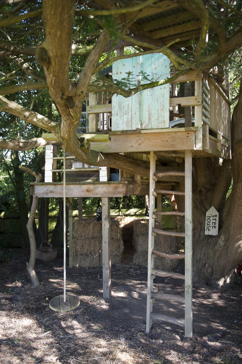 In the garden, an impressive treehouse was built by Rupert Walton, the children’s godfather. There is both a rustic ladder and a staircase to the deck and the little cabin has been beautifully constructed from reclaimed materials including a fine Regency style arched window