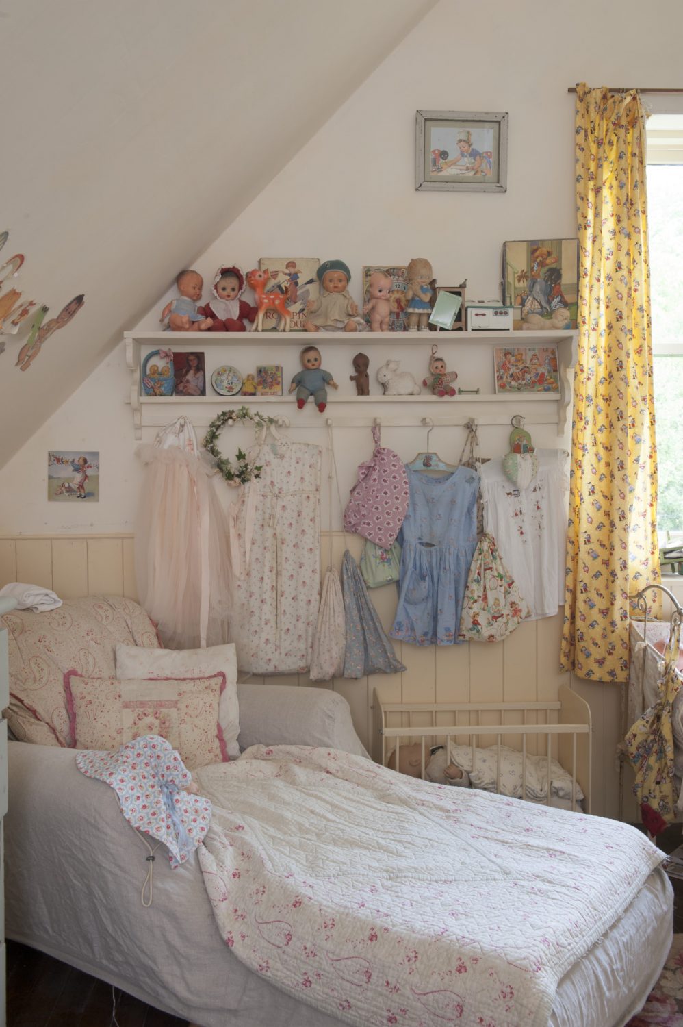 Bibby’s room is a delightful mix of buttermilk yellow and shell pink