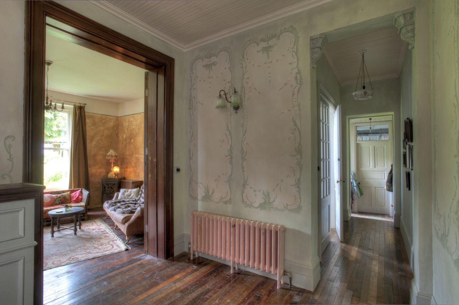 Susan’s delicately painted trompe l’oeil wall panels are a striking feature throughout the house