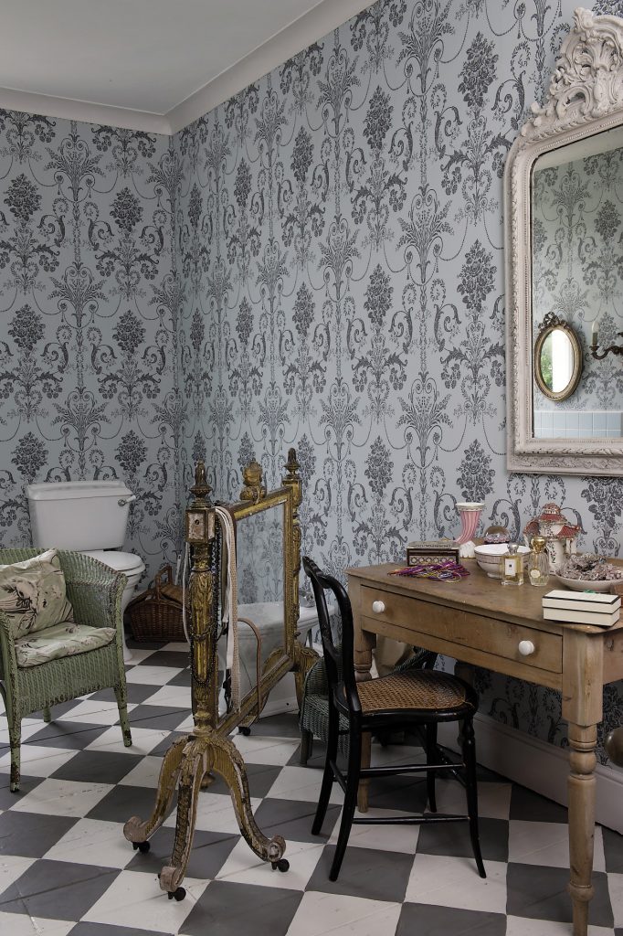 The bathroom on this floor. The wallpaper is a duck egg blue and charcoal grey damask style pattern from Laura Ashley and sets the tone for the space