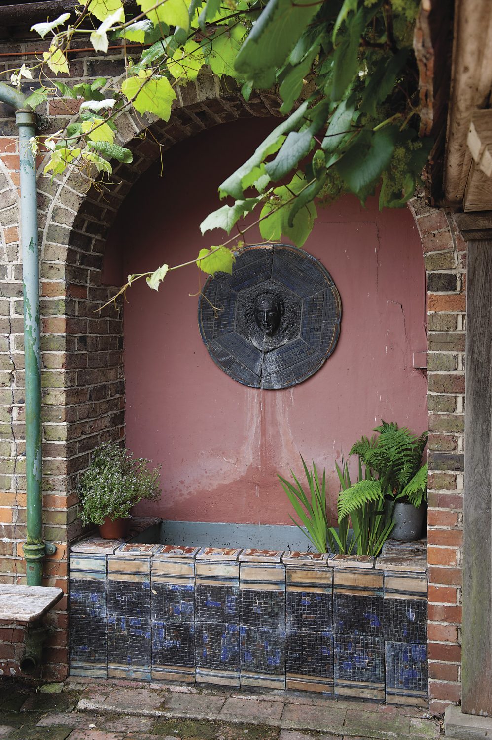 The tiled fountain that Duncan Bell created. “We’ve just got it working again and it’s wonderful to have the tinkling sound of the water carrying through into the house,” says Polly