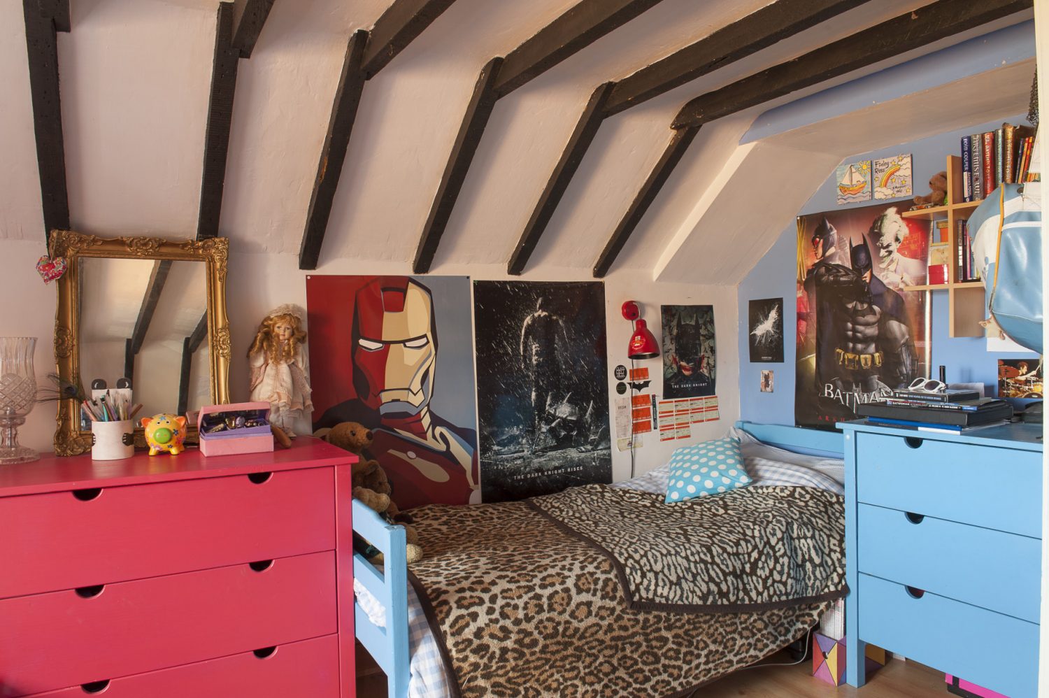 On the top floor with opposing red and blue walls is daughter Amber and son Finlay’s bedroom