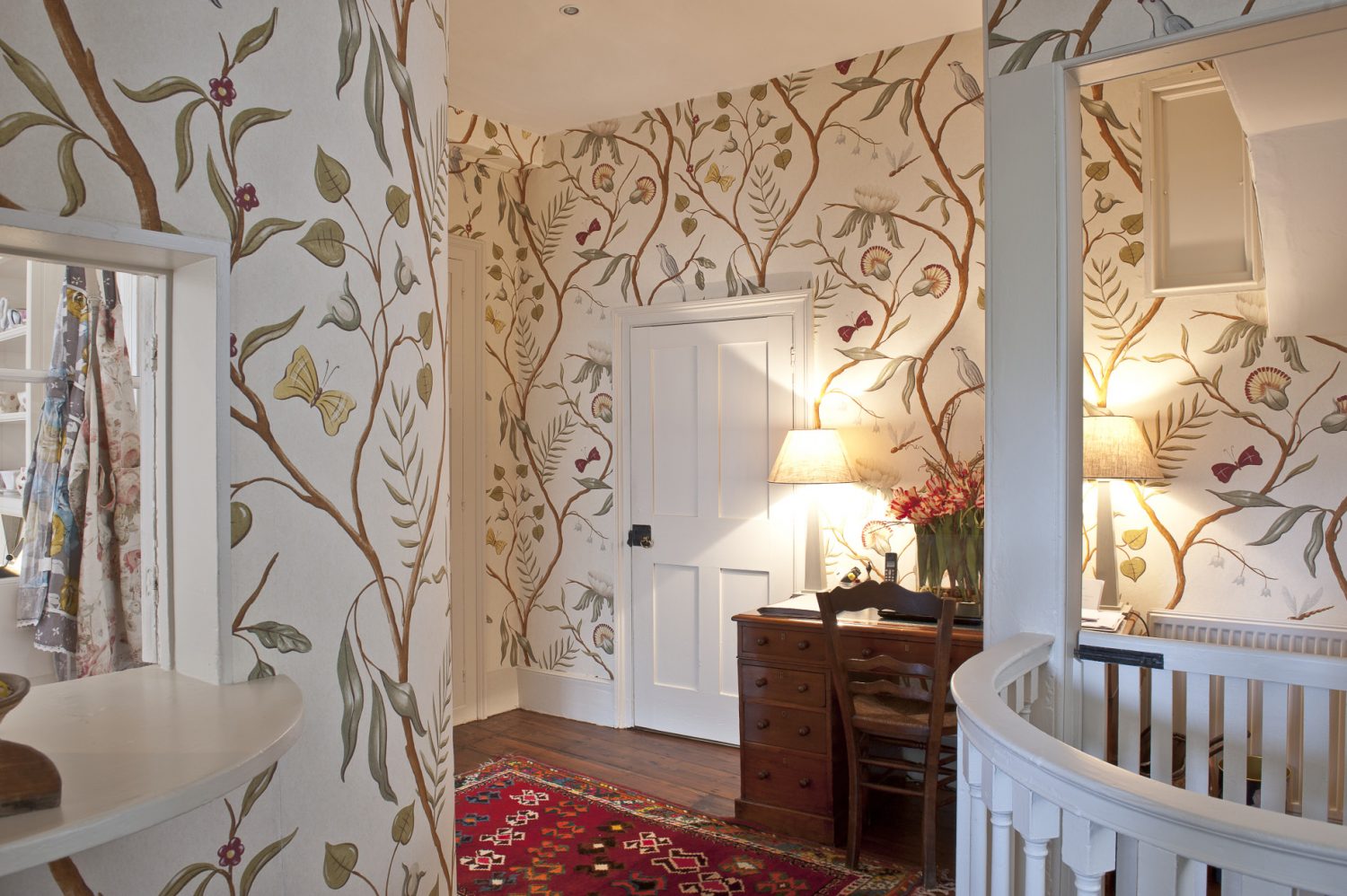 Adam’s Eden by Lewis and Wood, Belinda’s favourite wallpaper, looks very much at home in the hallway