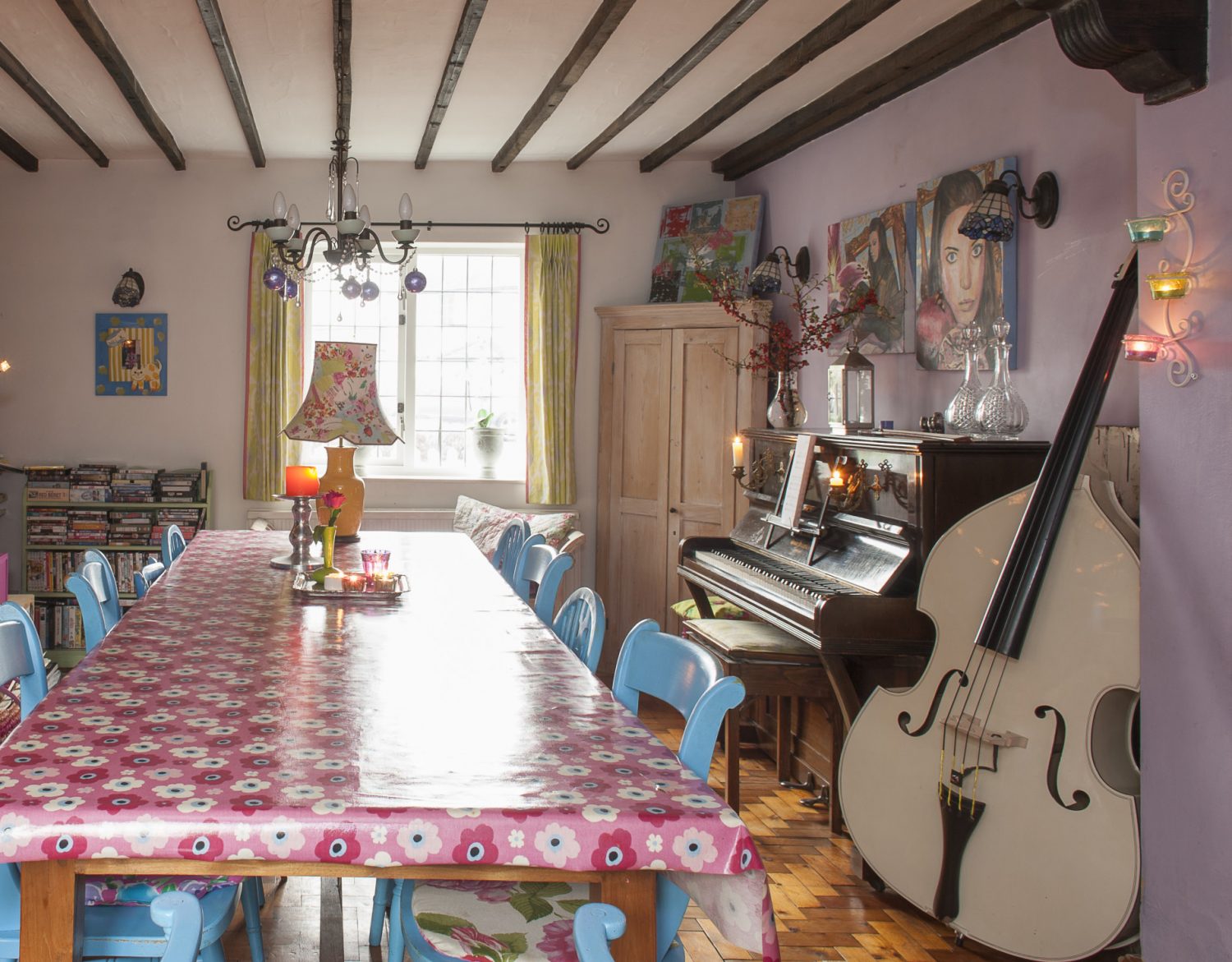 The spacious dining room is painted a strong lilac and everywhere there are witnesses to the family’s artistic and musical commitments