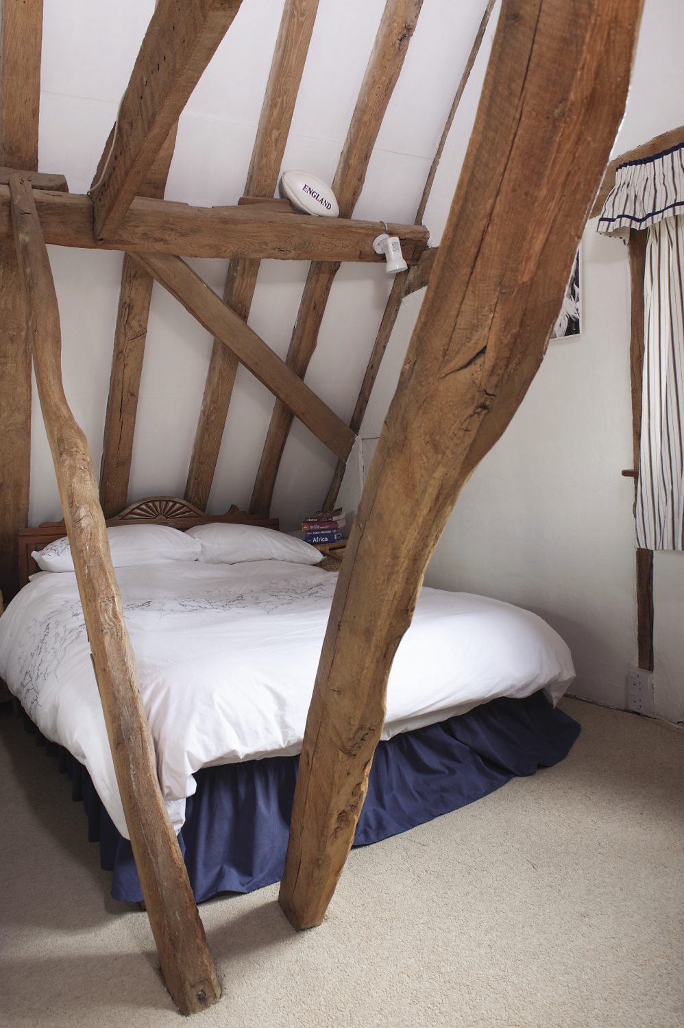 At the top of the house, the couple’s son’s room displays more of David’s craftsmanship. The floor here careers away from the window towards the door at such an angle that one leg of the bed is almost half the height of the other