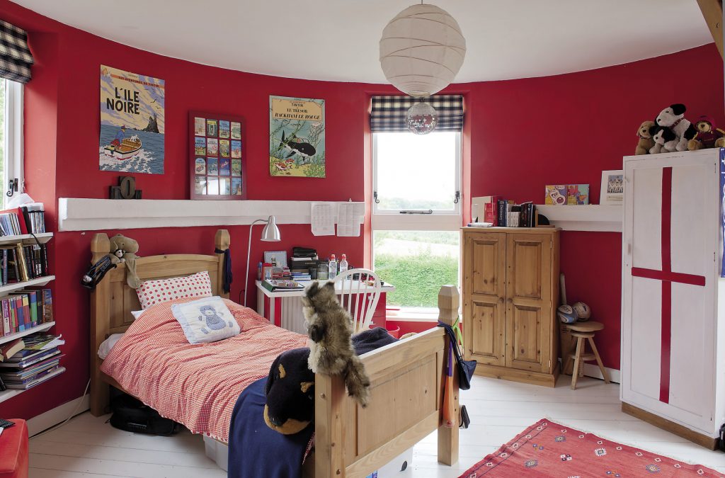 Son Tom’s room is deep red, very much a boy’s room and currently shrine to Tin Tin, a legacy of the family’s time in Brussels