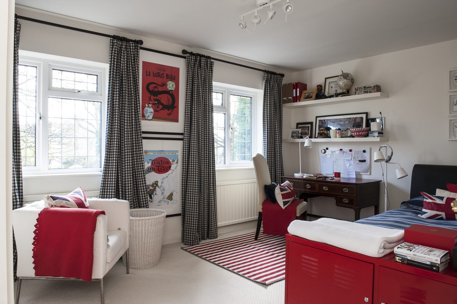 Adele’s son’s room is red and white and a pleasing juxtaposition of old and new