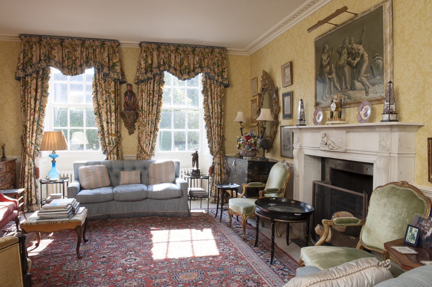 The drawing room was originally two rooms, that were made into one in the 1830s. The walls are papered in Zoffany ‘Damask Design’