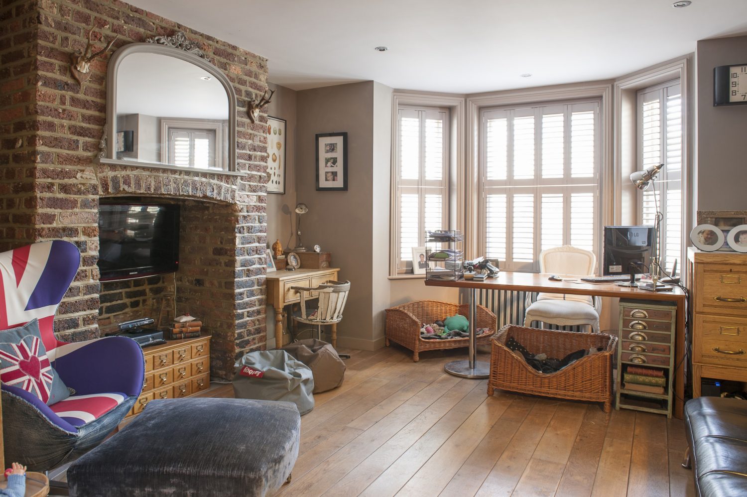 The walls are the original glowing brick and white lime mortar and the floor throughout oak boarding