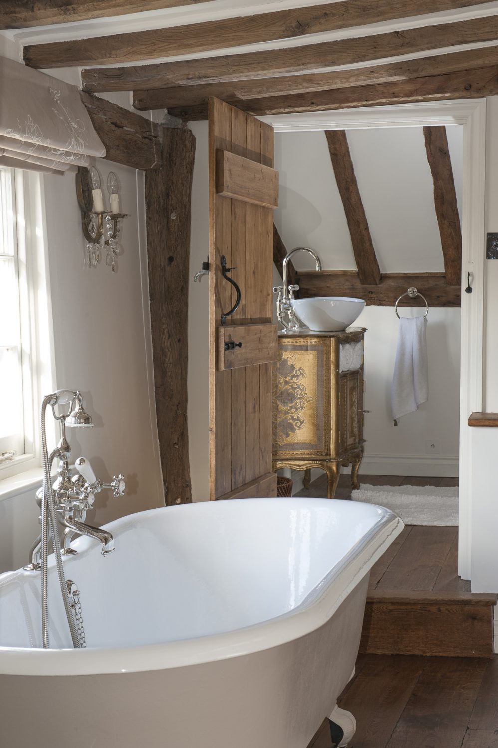 Charlotte and Andrew remodelled their en suite to provide both a romantic bathroom, with a rolltop bath, and a double-shower room