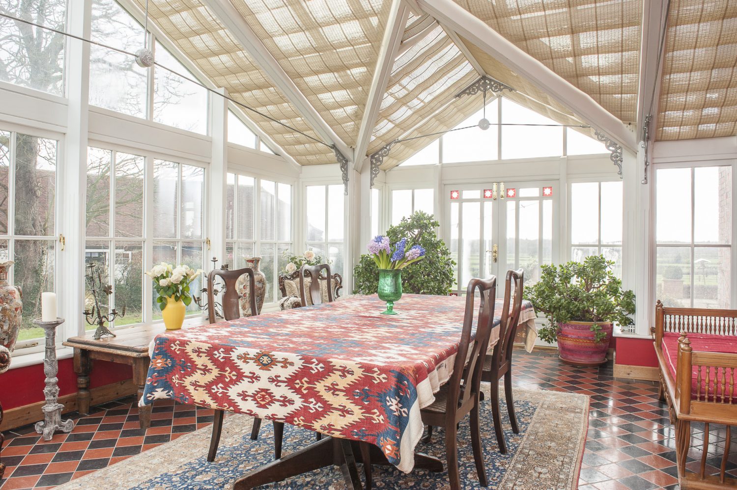 The large conservatory looks out over one of the couple’s two beautiful large ponds. Centrepiece of the room is a great table that previously belonged to the Bank of Siena