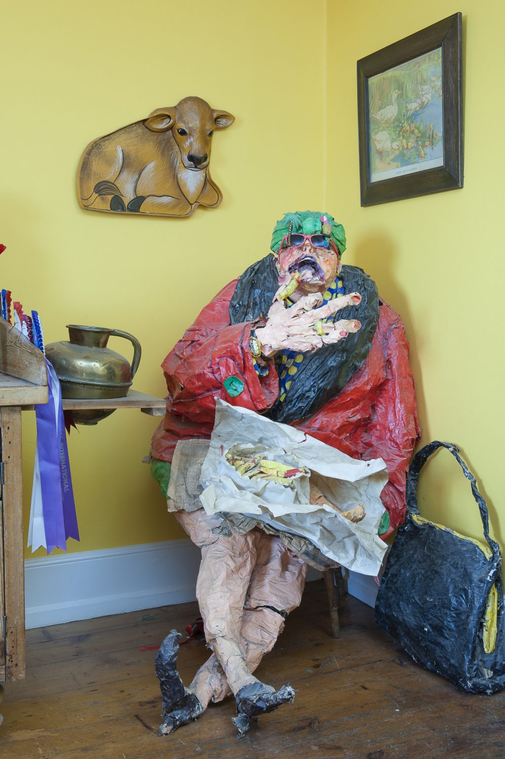 In one corner of the kitchen sits a vast papier mâché old lady eating fish and chips by Hastings artist Jo Redpath