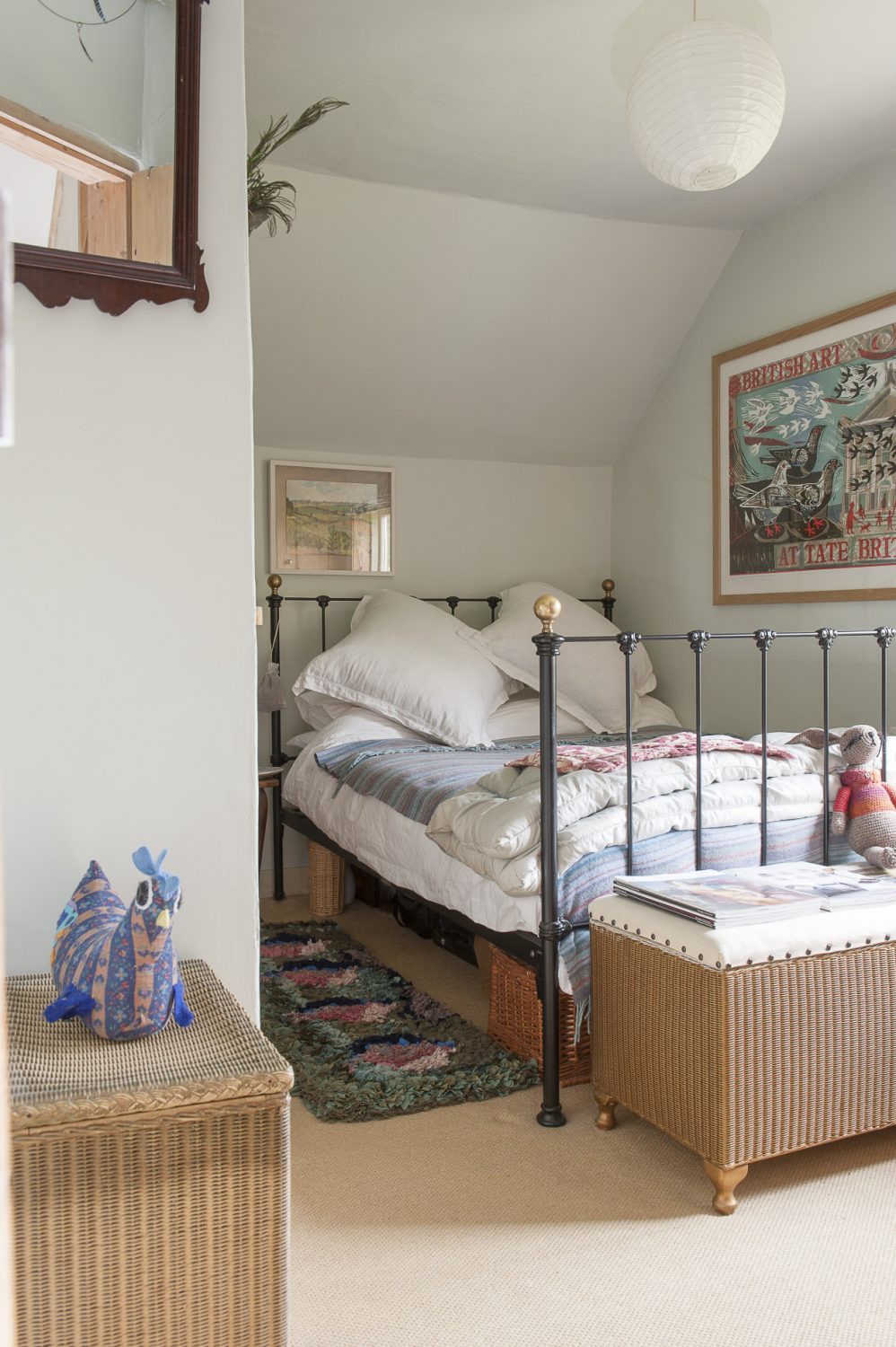 The bed in the guest room is dressed with an invitingly cosy eiderdown and plump pillows
