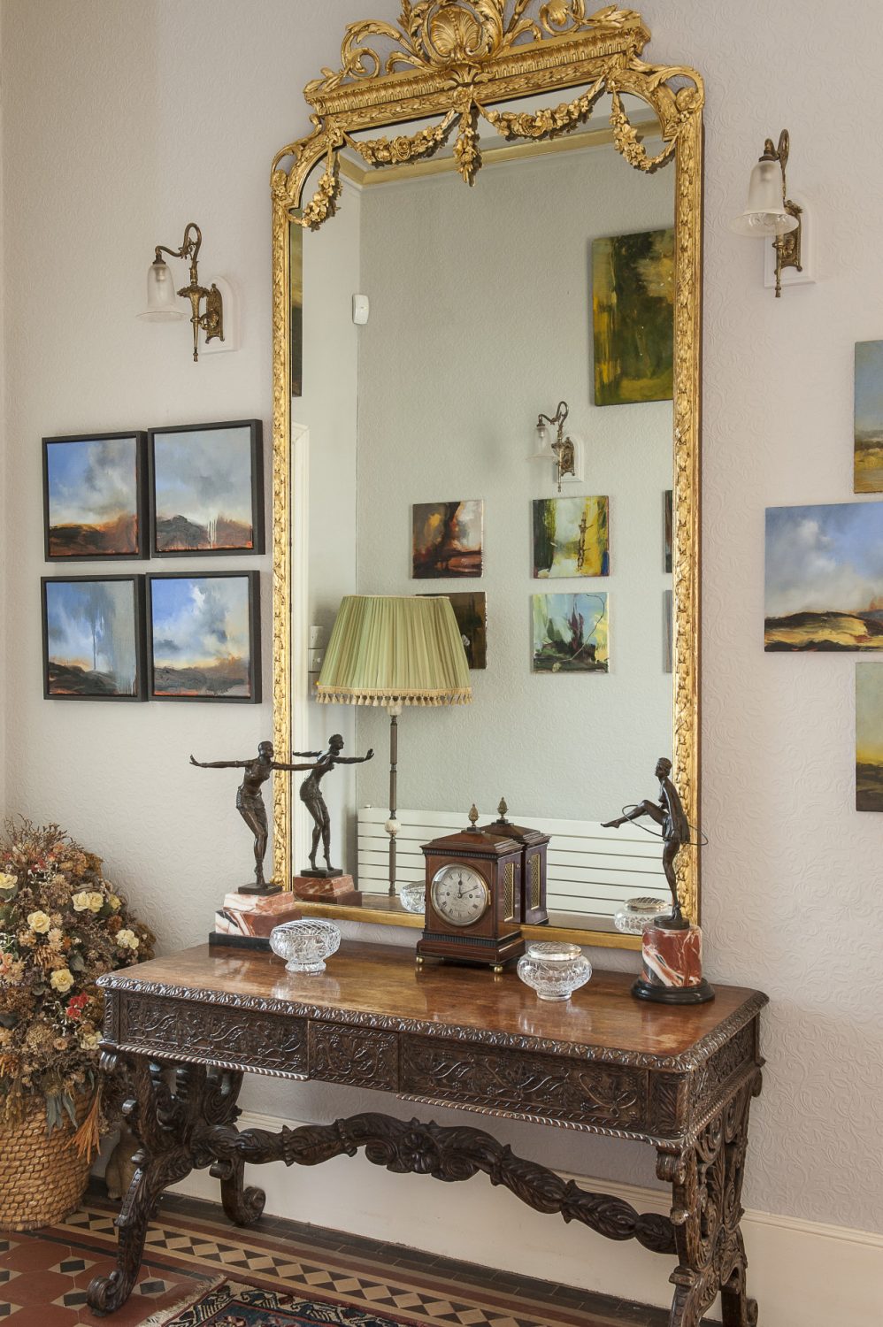 The large gilt mirror in the hallway reflects part of Ken’s collection of Rankle