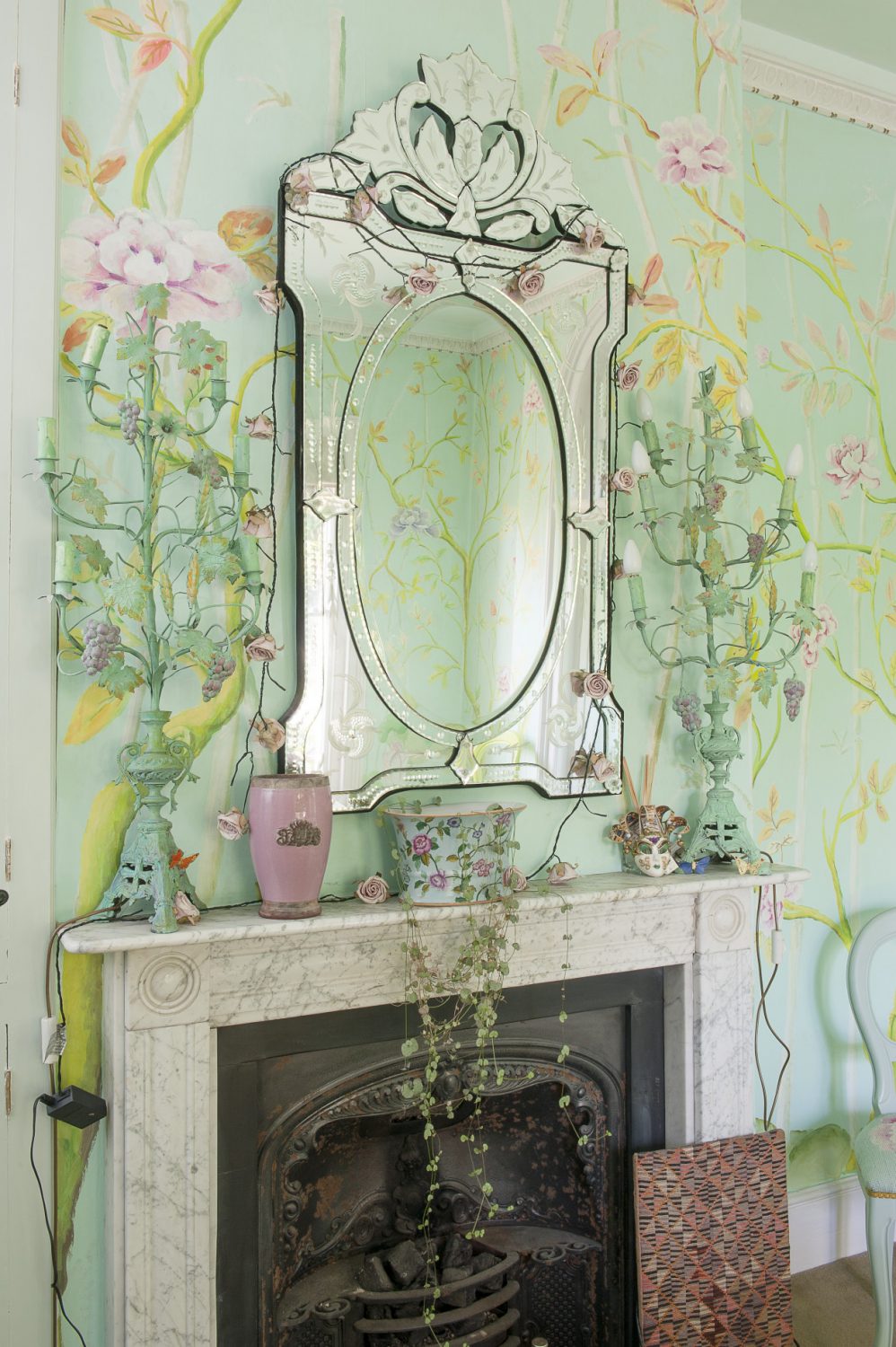 Kaffe and Brandon had originally intended to paper the dining room with hand painted Chinese wallpaper, but Kaffe painted straight over the original paper with Duck Egg Blue and an intricate design of bamboo and peonies