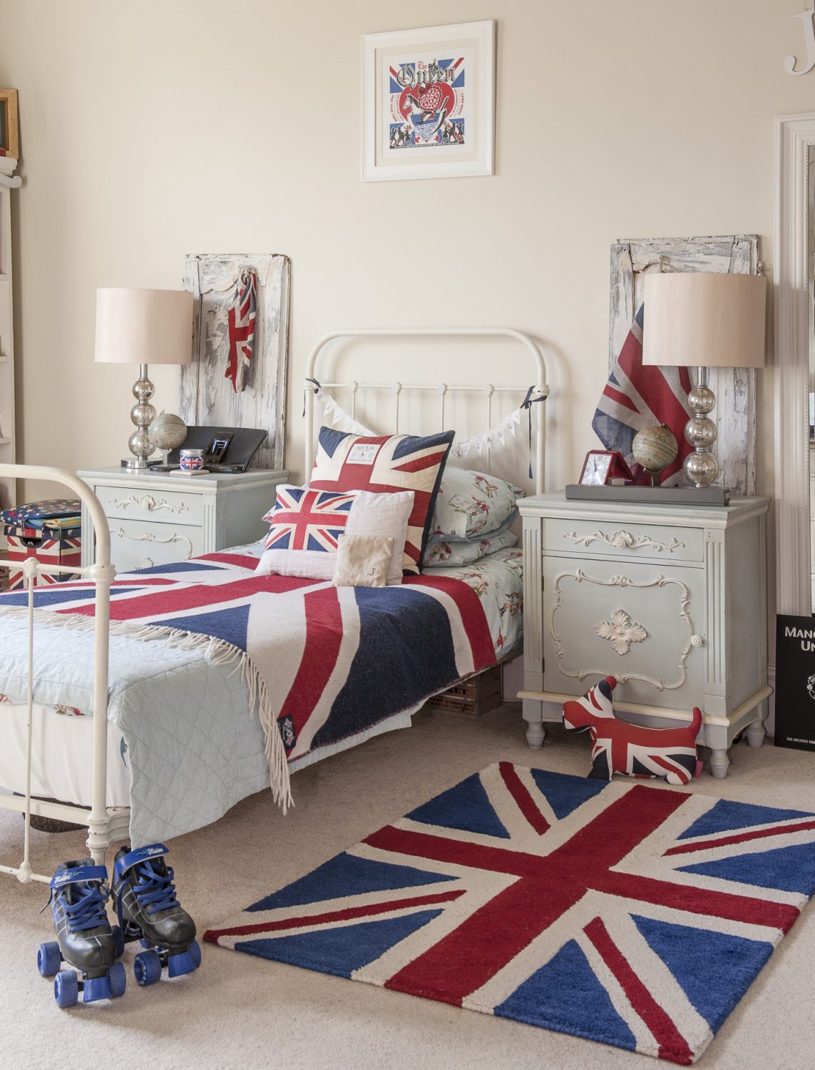 Son James’s immaculate room features a French distressed dressing table, French antique bedside tables and a Union Jack bedspread and rug