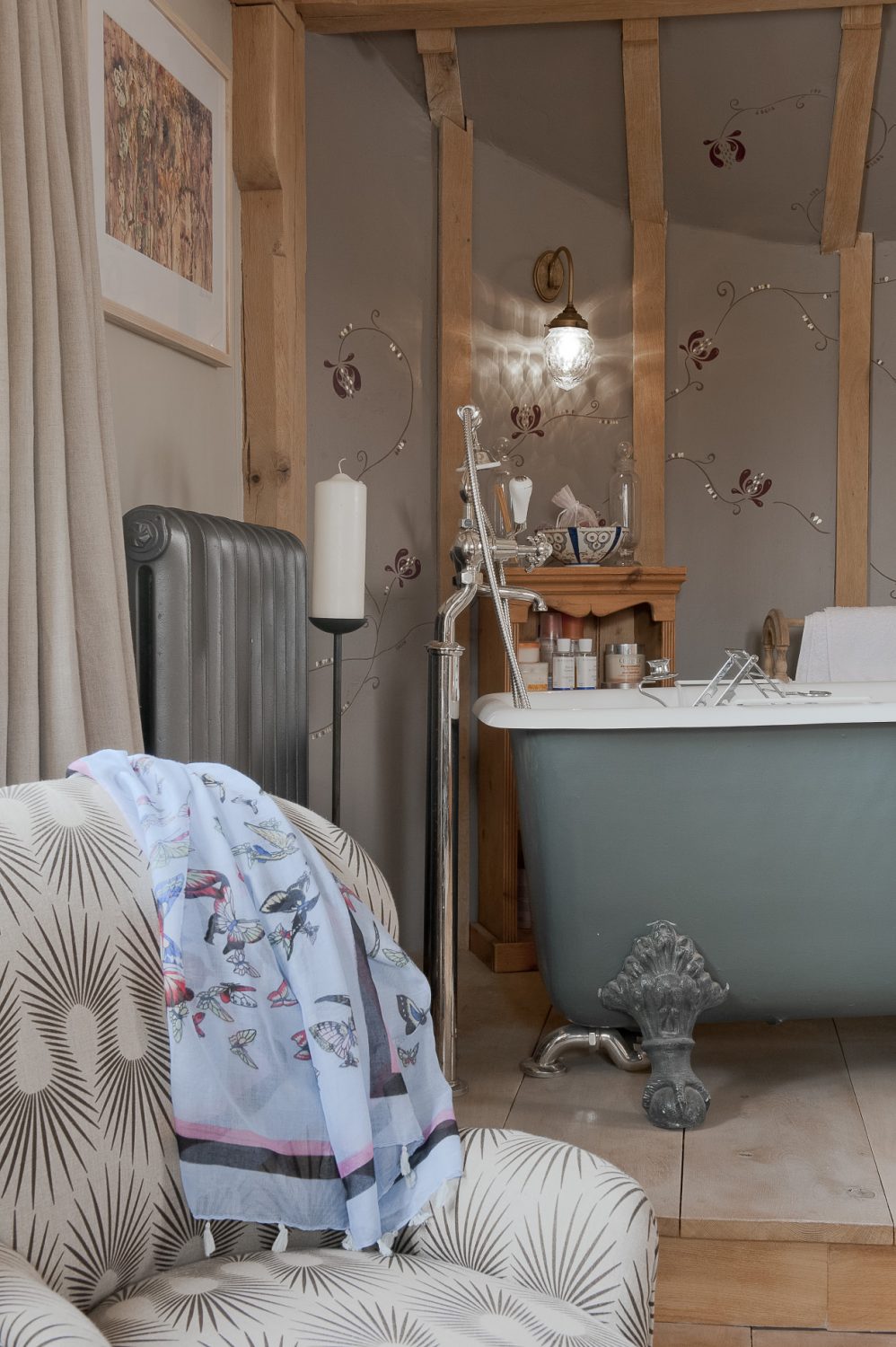 In Moyna and Richard’s room a handsome rolltop bath is mounted on a dais in one corner