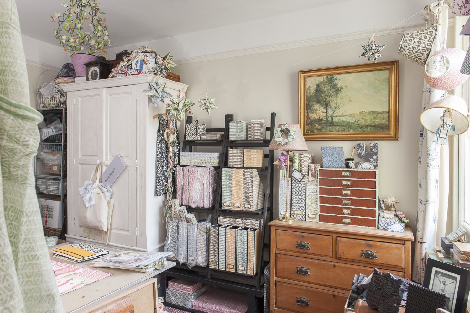 Trudi’s workroom shelves are stacked with files in pretty prints, papers and prototypes