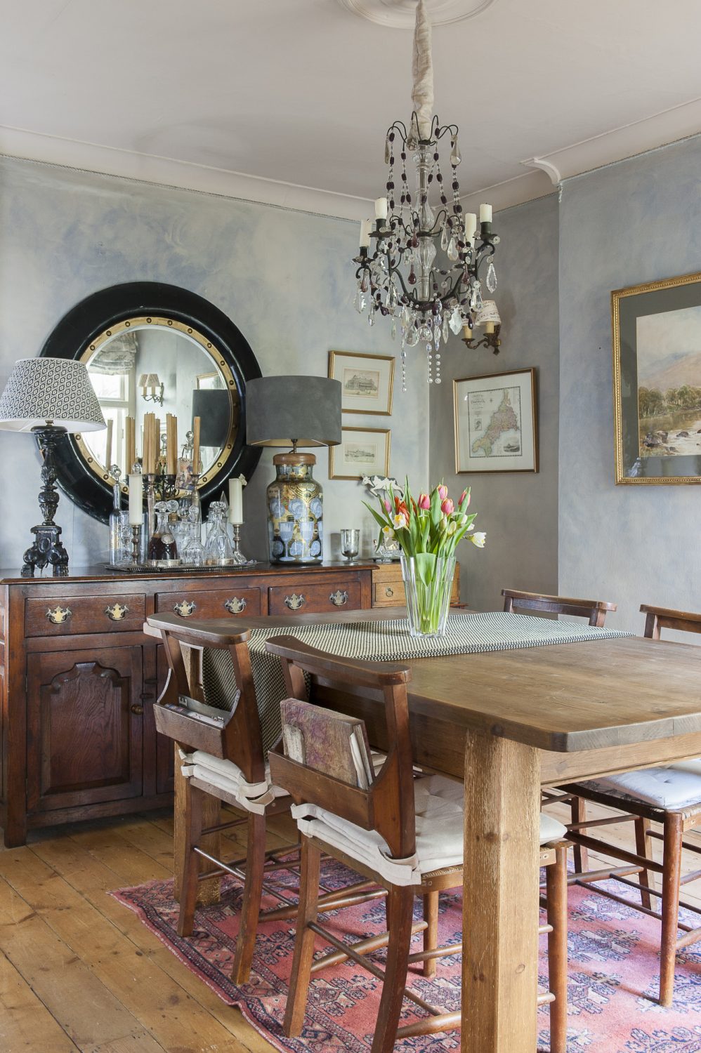 A subtle nautical theme runs through beach pictures and maps on the walls of the dining room, while a huge round mirror resembles a porthole: “That came from a friend. She was getting rid of it and I thought, ‘Wow! I love it,’ ” says Trudi