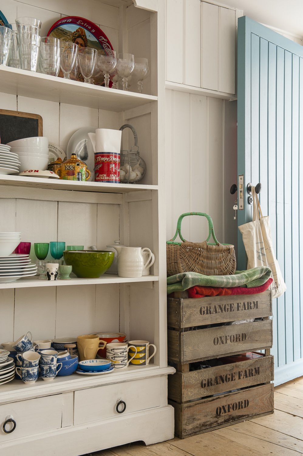This includes the rack of wooden shelves by Garden Trading and everything in them: enamel bowls and jugs of various sizes, vintage cups and saucers and cook books