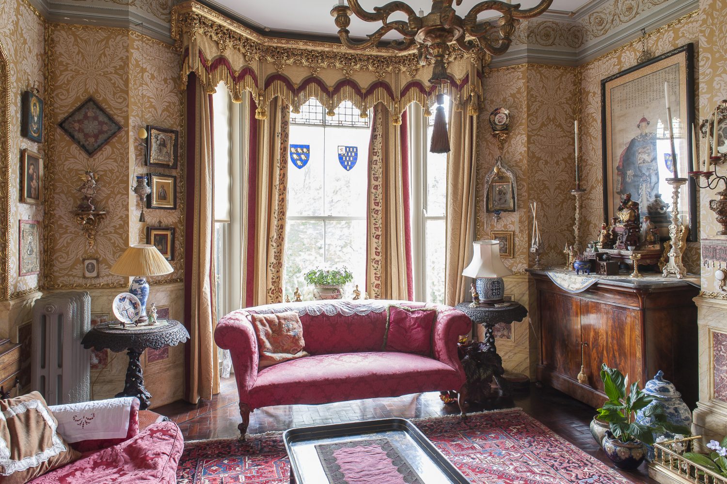 Decorative bullion and tassels hang from the elaborate pelmets in the drawing room