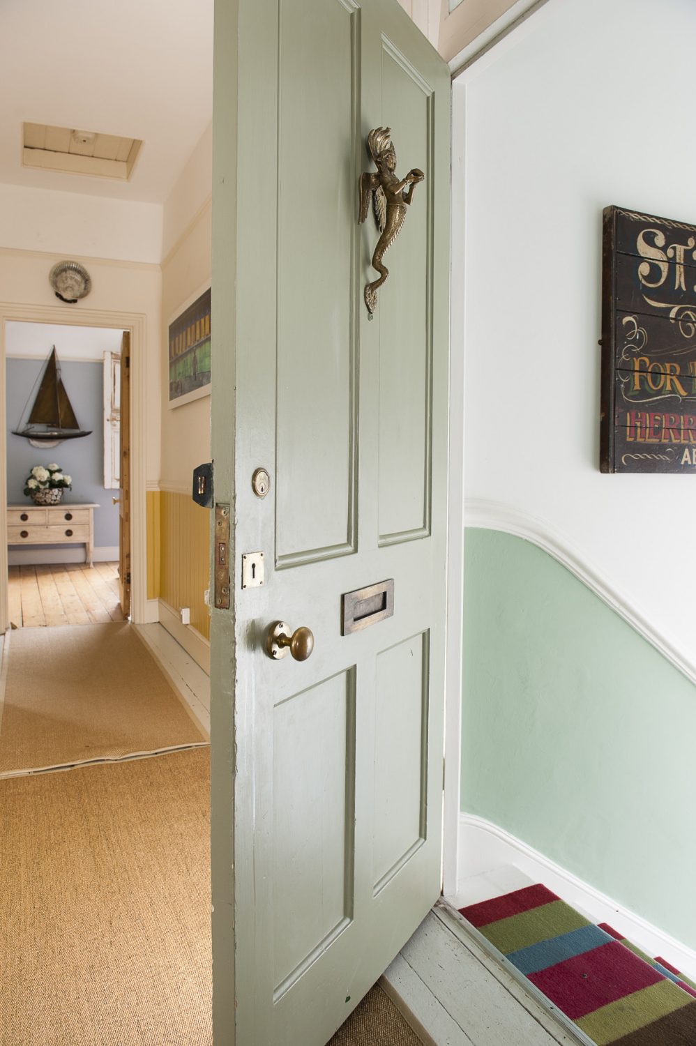 There’s something rather Famous Five about walking out of one front door, scuttling up the stairs – past the wonderful ‘steam trawler’ sign Susie bought in an antique shop in Norman Road – and in through the front door of another flat