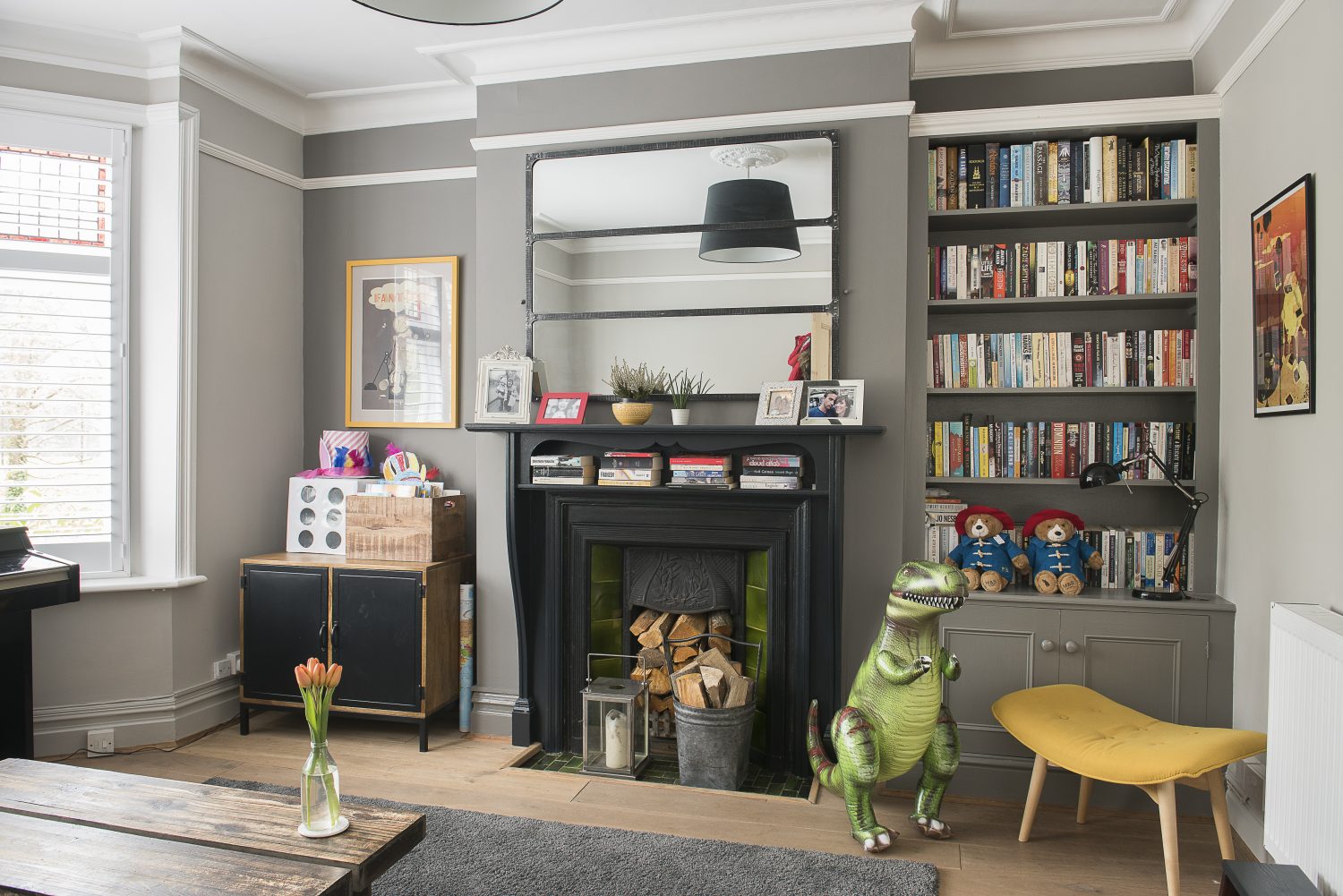Caroline initially intended on turning the playroom at the front of the house into a snug. The walls are painted in Pavilion Gray and Mole’s Breath by Farrow & Ball and prints on the wall were found at Battersea Affordable Art Fair