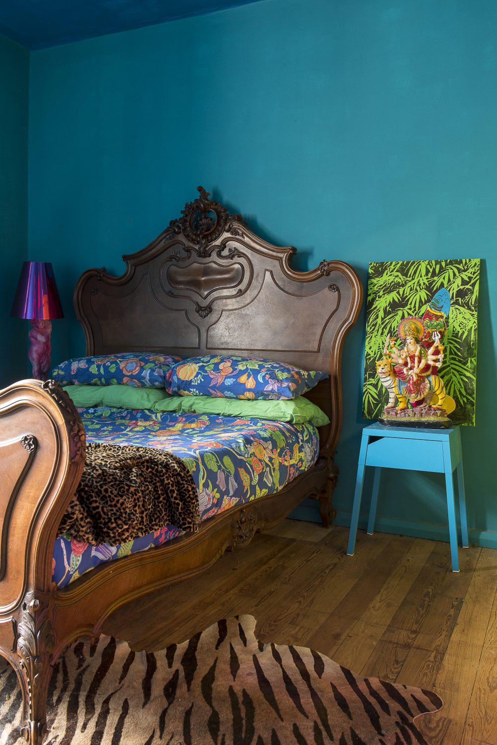 The walls of the bedroom have been painted a deep teal colour. “I was worried when I painted this room, as it came out much darker than I thought it would, but now the furniture’s in, it looks okay,” says Amy