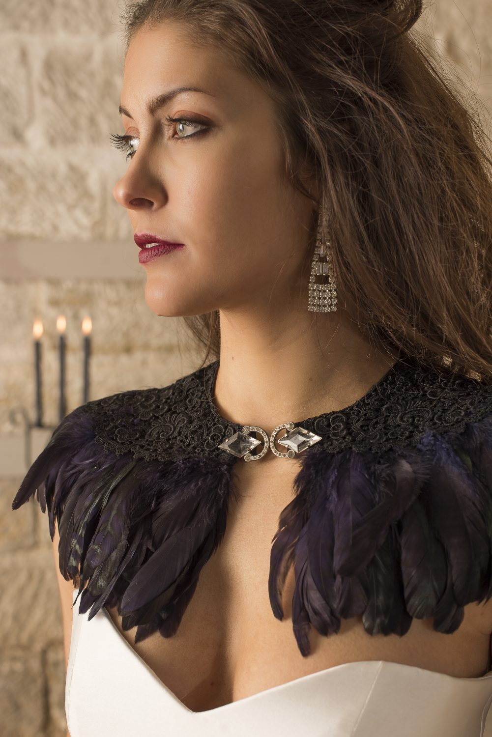 Vintage chandelier earrings, £22, Victorian lace feather capelet, £180, Crystal Heirlooms crystal-heirlooms.co.uk 07717 467049; Stephanie Allin Lucerne dress, £2175, The Bridal Boutique of Jules boutiqueofjules.co.uk 01304 389710