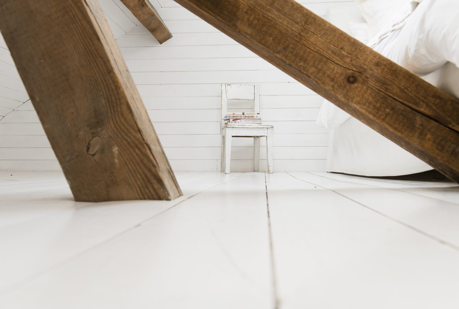 Marta created a new double bedroom in the eaves of the house, large and airy with light pouring through Velux windows, accessed by this ship-like ladder
