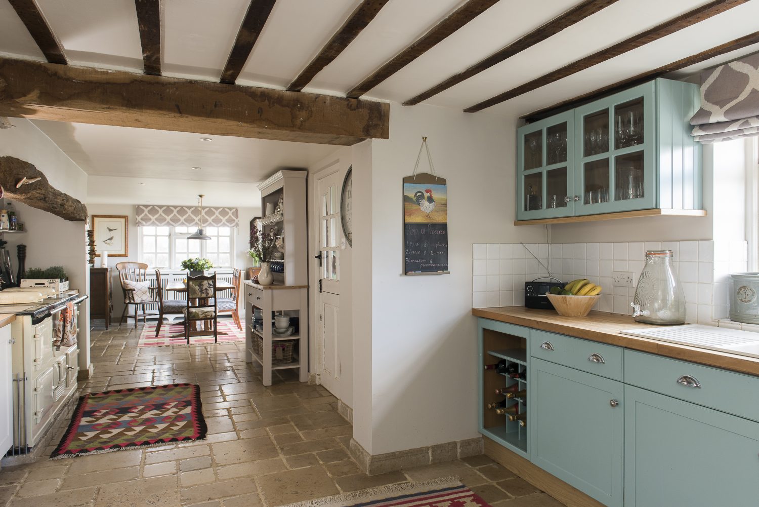 Jo put in the dining room extension which joins up the kitchen and the snug, when she first moved in 14 years ago, combining the beams of the original 16th century cottage with a light airy modern feel. The glorious four-oven Aga, was already in place