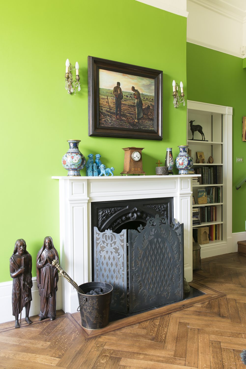 The wonderful pea green paint in John’s study also by Little Greene. The curtain fabric is by Lacroix. John’s computer is cleverly hidden behind doors in the bookshelves. The Chinese porcelain Foo Dogs – or ‘guardian lions’ – on the mantelpiece are another of Jane’s favourite things to collect