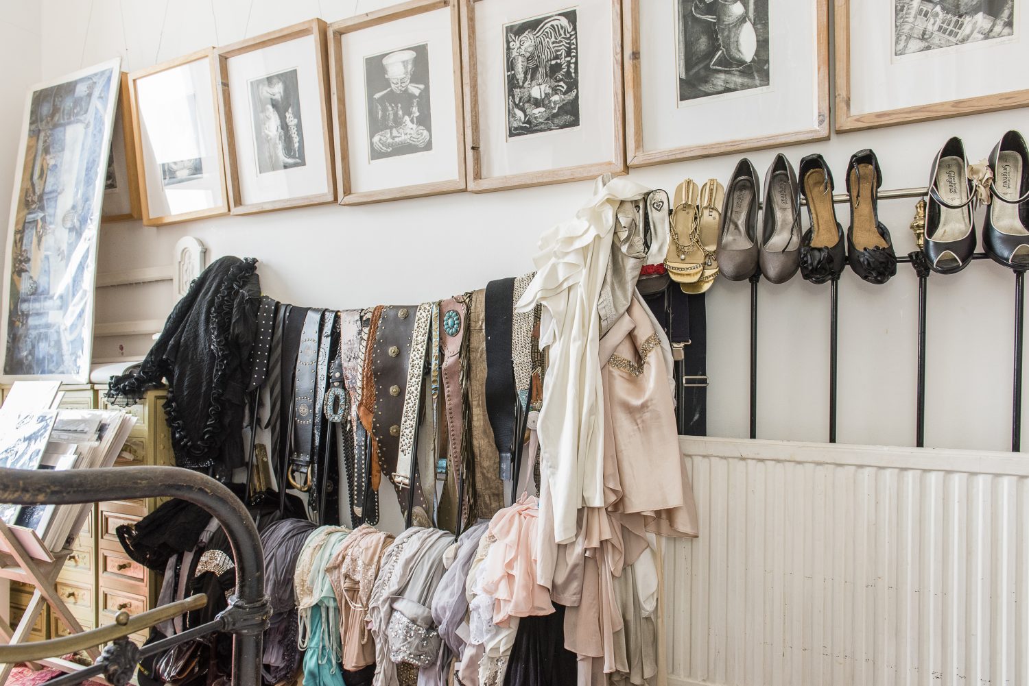In Sassy’s own smaller bedroom collections of vintage dresses, shoes and belts line the walls