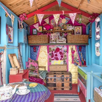 The beach hut is decorated in the same pink and blue colour scheme as Annemarie’s house, with more wallpaper samples