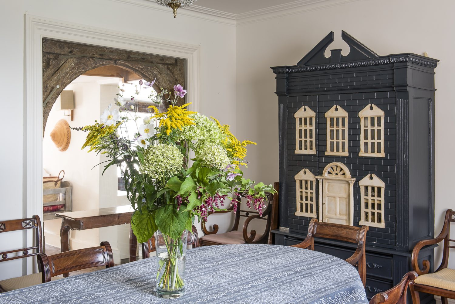Julia bought the doll's house in an antique shop and painted it in Farrow & Ball Railings