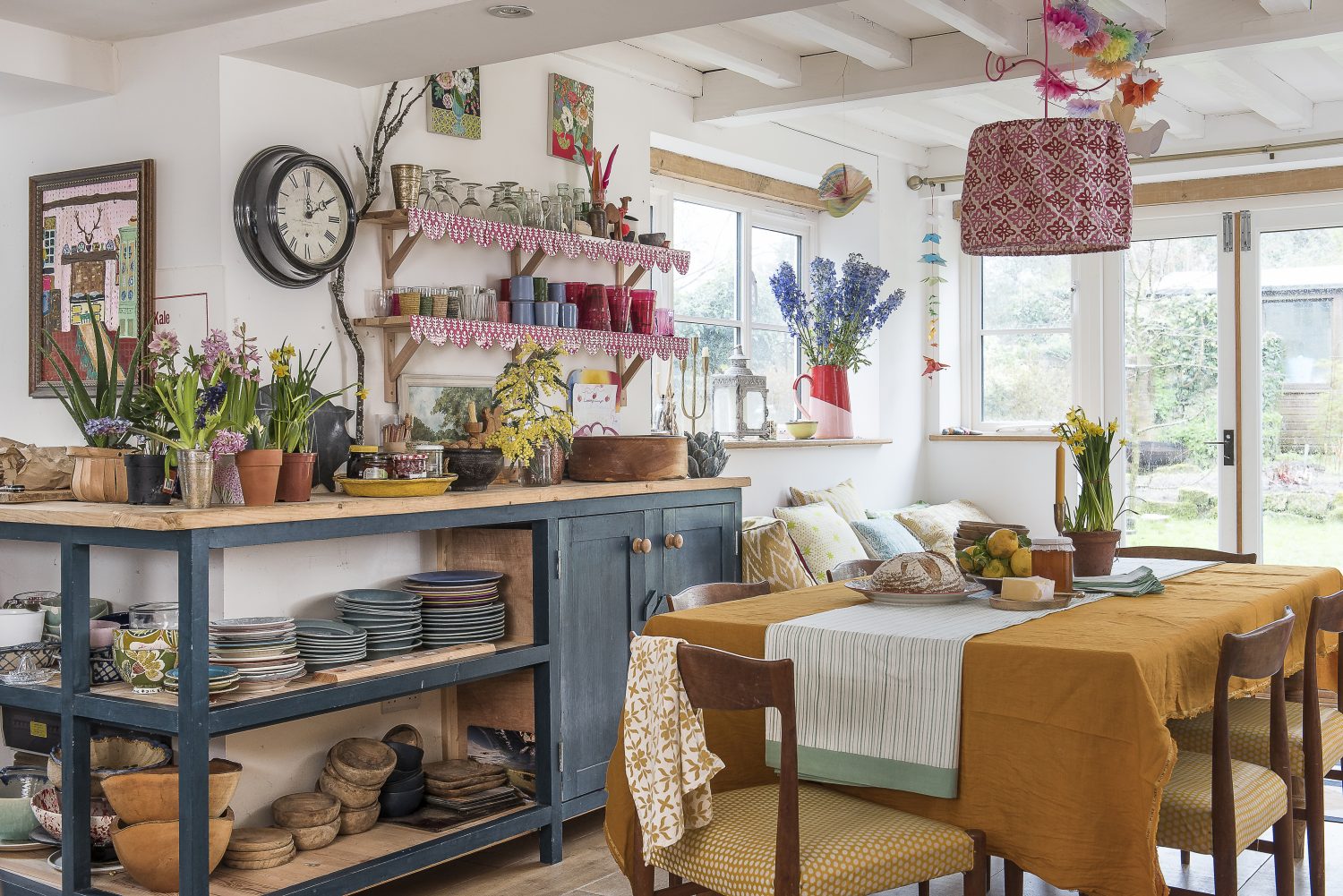 The lampshade over the kitchen table is in Molly’s design Pattee. The worktops were made from scaffolding planks