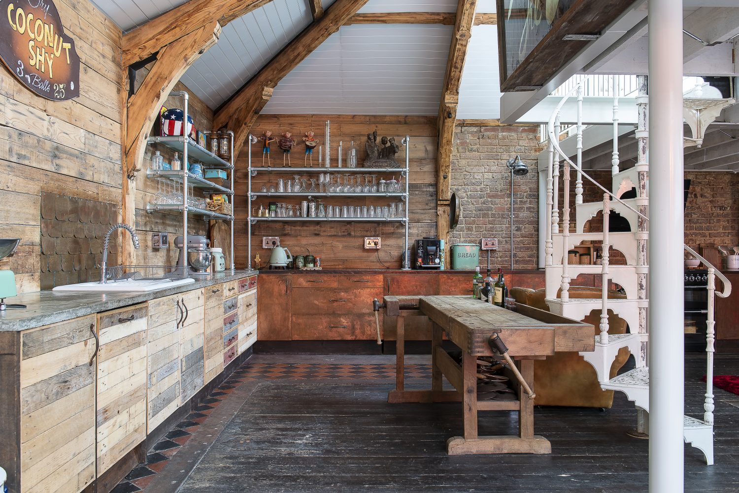 The fish-scale style copper splashback behind the kitchen sink was the result of a search for local panel beaters