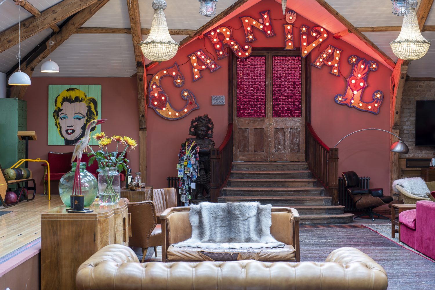 A huge neon ‘Carnival’ sign by Chris Bracey hangs over The Bath House’s double doors