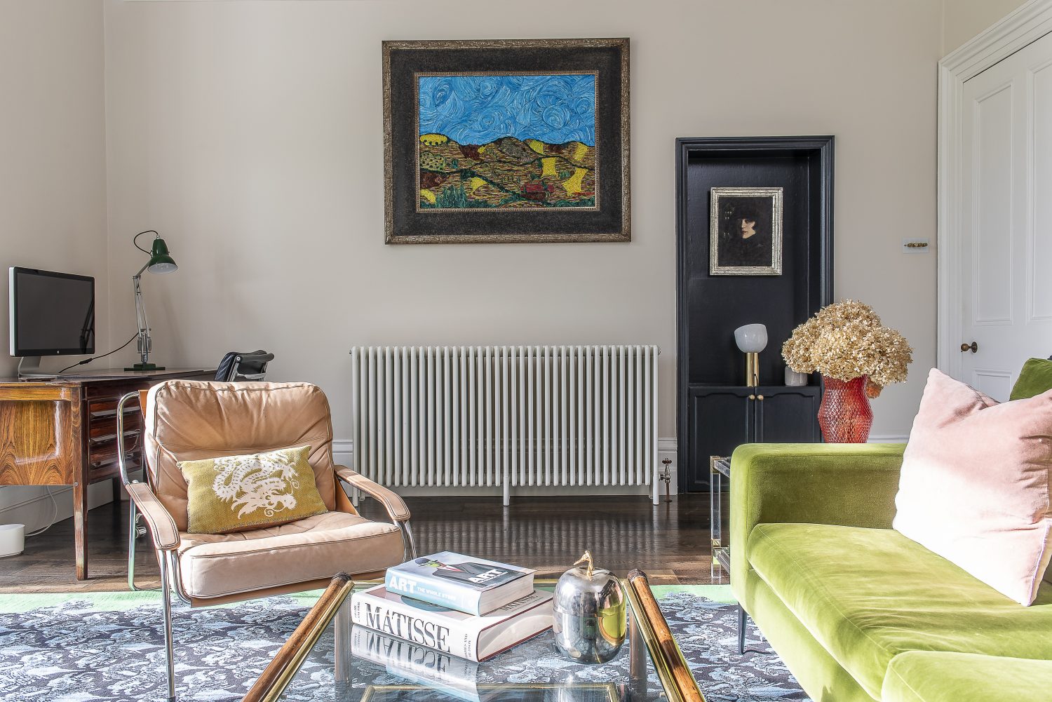 The focus in Olya’s husband’s study is a piece by the artist Louis Midavaine, a copy of one of Toulouse Lautrec’s Moulin Rouge paintings from the 19th century. A rug from The Rug Company and a bright green Conran velvet sofa compliment the painting’s palette