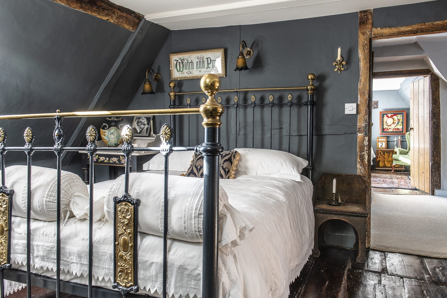 The attic bedrooms have a darker, more historic fee