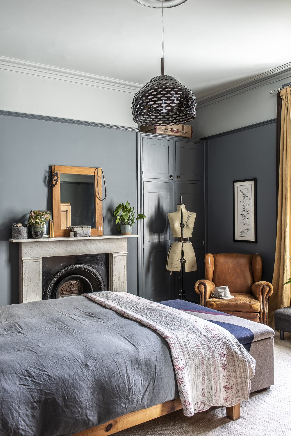 Sadie’s own bedroom is decorated in a palette of dark and light greys, golds and leather