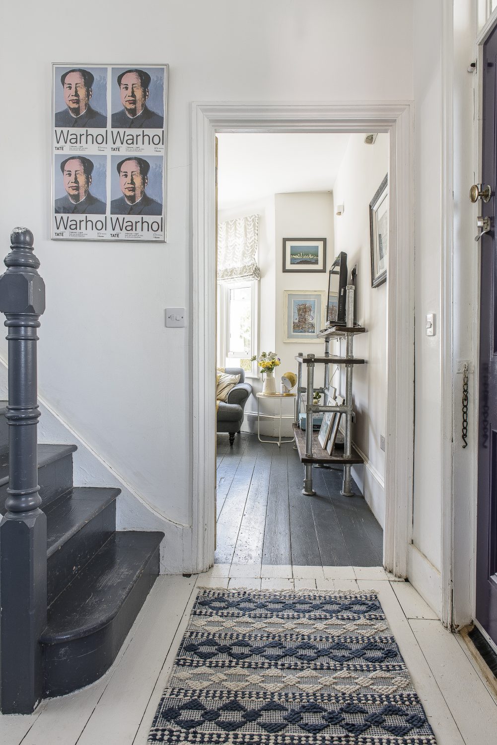 A clutter-free entrance hall leads into the dining room on one side and sitting room on the other